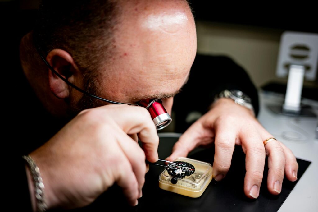 watchmaker servicing mechanical watch