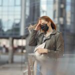 woman wearing necklace with scoop neck